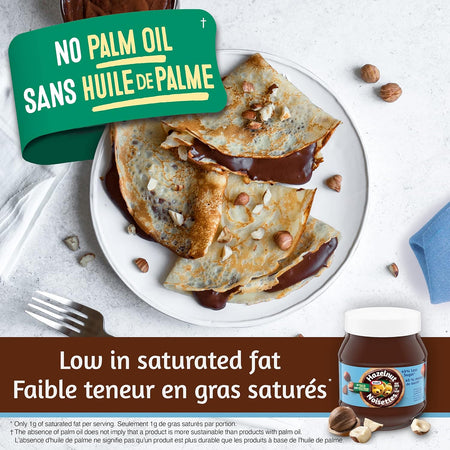Crepes with chocolate sauce on a plate, jar of chocolate spread, and text about palm oil-free and low saturated fat content.