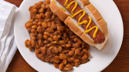 Sprague Prince Edward Country Baked Beans, Ready to Eat, 398ml/13.5 oz., Can, baked beans served with a hot dog.