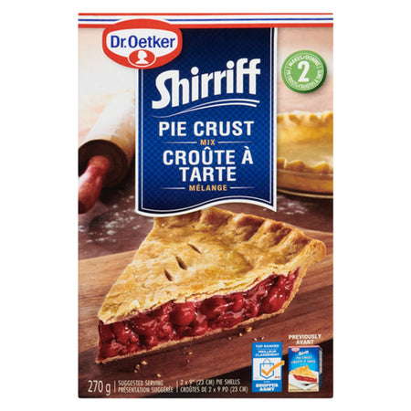 Box of Dr. Oetker Shirriff Pie Crust Mix with a pie on a wooden board.
