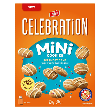 Box of Leclerc Celebration Mini Cookies with a white glaze drizzle on an orange background