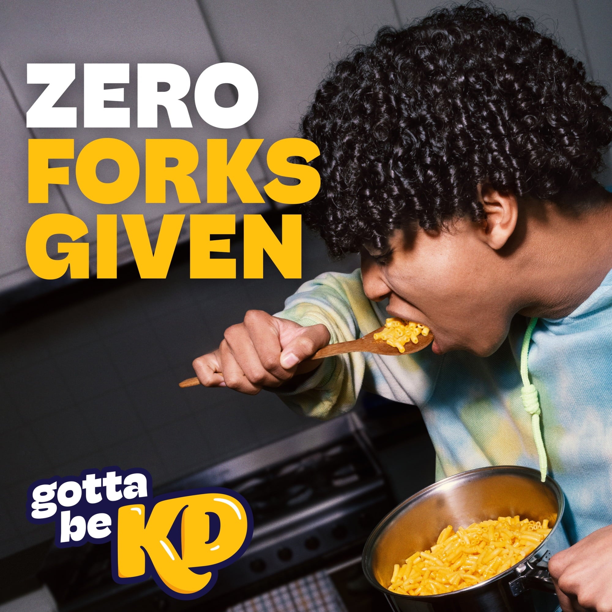 Person eating macaroni and cheese with text 'Zero Forks Given' and 'gotta be KD' logo.