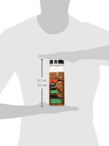 Club House La Grille Montreal Chicken Spice Jar 675g held by a person with dimensions indicated.