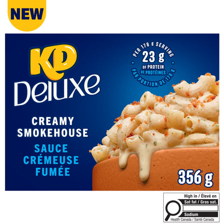 KD Deluxe Creamy Smokehouse sauce packaging with macaroni and cheese on a white background