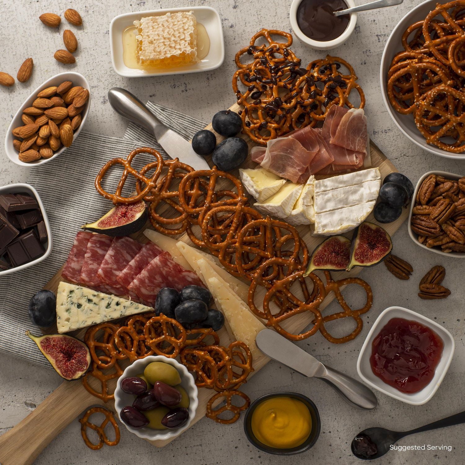 Old Dutch Baked Mini Twists Pretzels on charcuterie board.