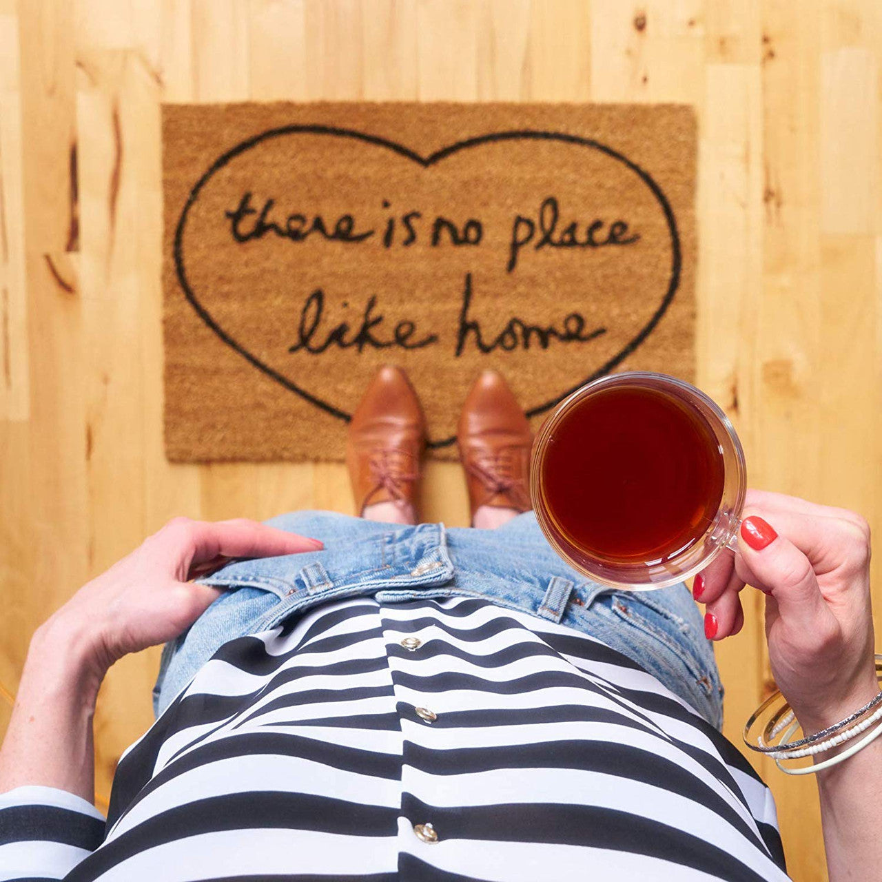 Tetley Orange Pekoe Decaffeinated Black Tea - 48 Count, 96g/3.4 oz., Package, brewed tea in a cup.