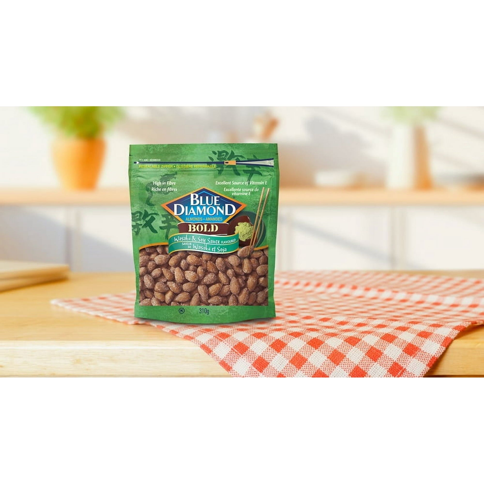 Bag of Blue Diamond almonds on a checkered tablecloth with a blurred kitchen background