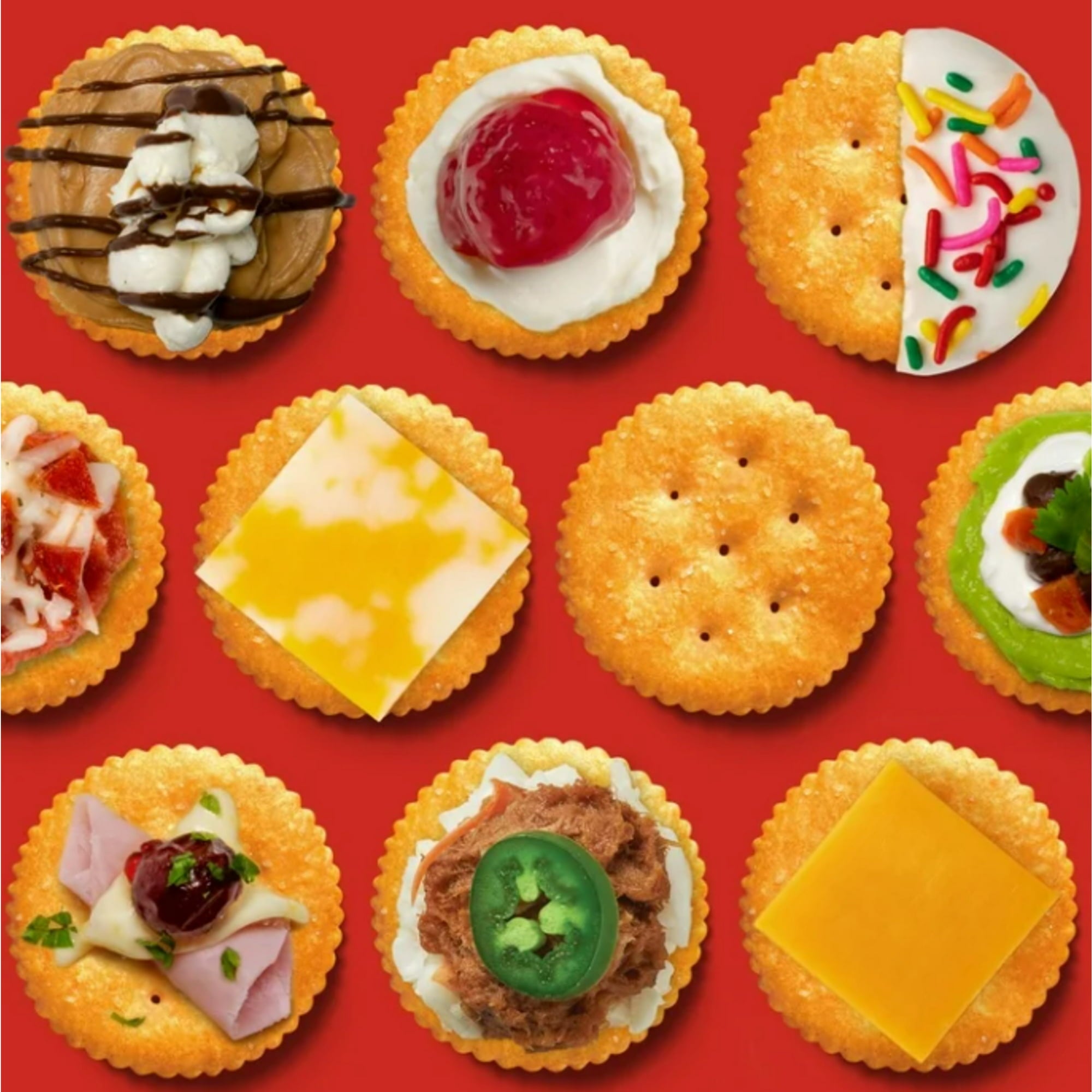 Assorted Ritz crackers with various toppings on a red background
