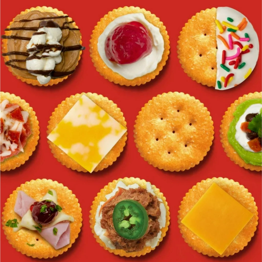 Assorted Ritz crackers with various toppings on a red background