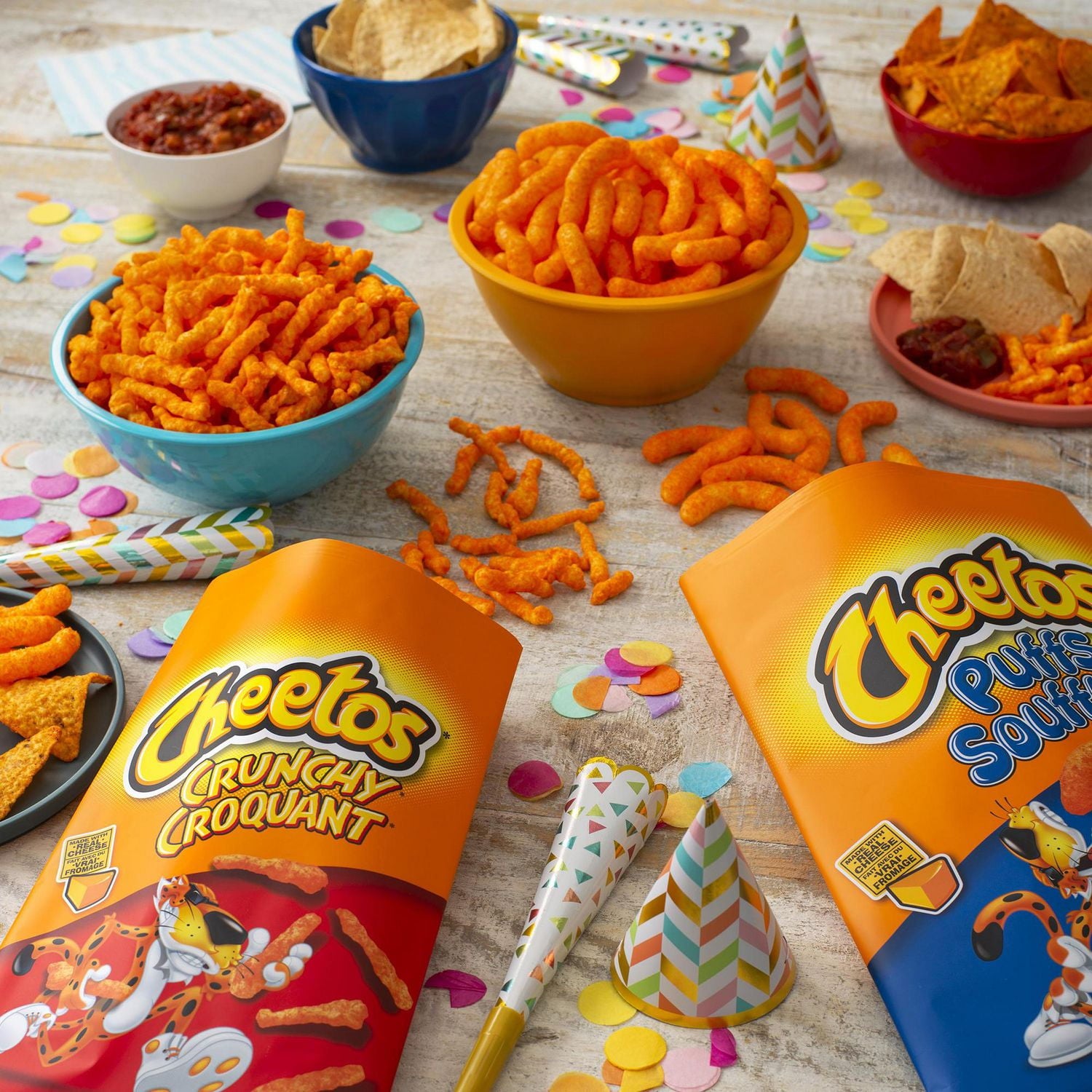 Cheetos Crunchy Cheddar Jalapeno Flavored Puffs, 54g, picture of cheetos puffs in a bowl.