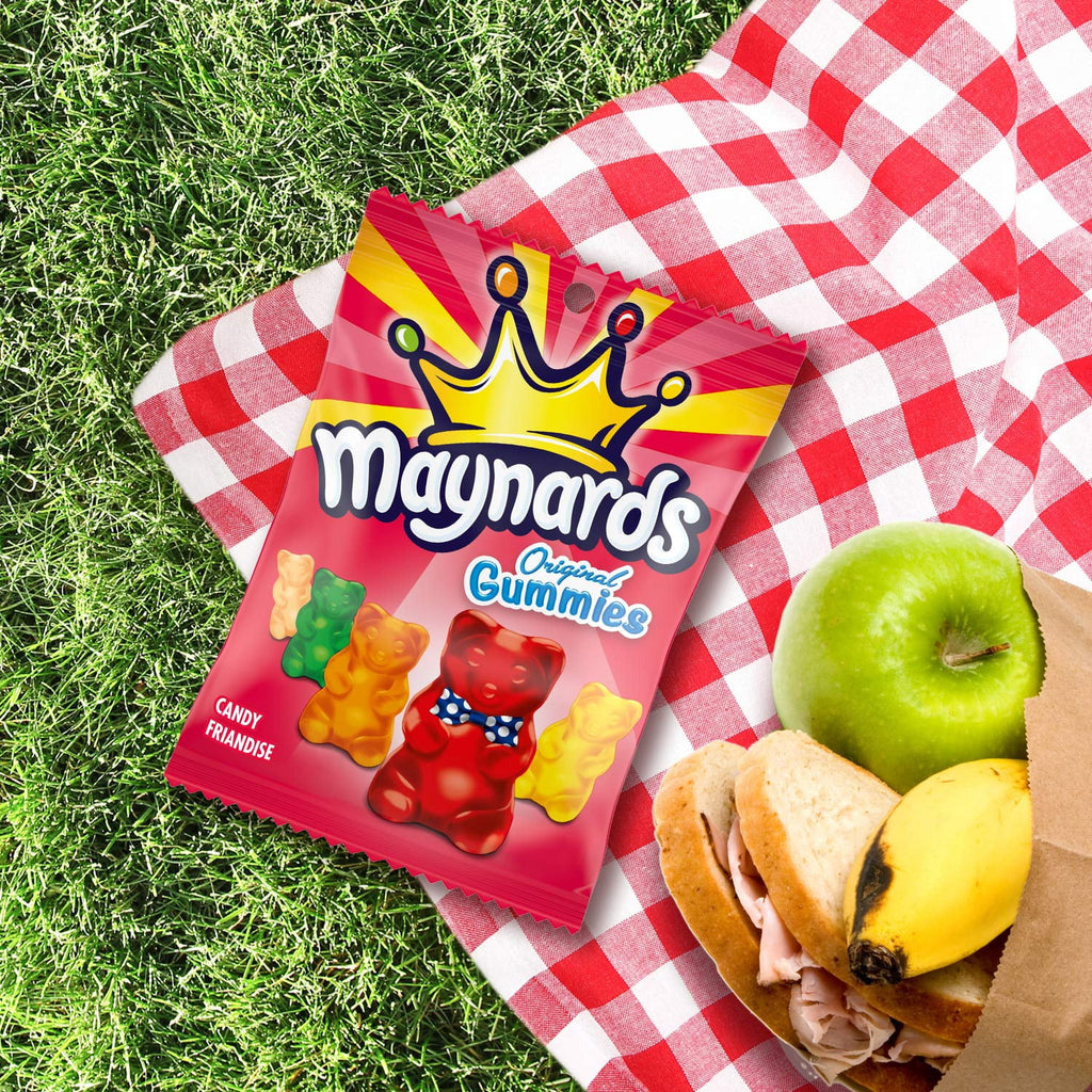 Maynards Original Gummies packet on a red and white checkered blanket with picnic food.
