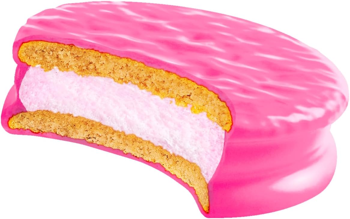 Pink wagon wheel cookie with a bite taken out on a white background