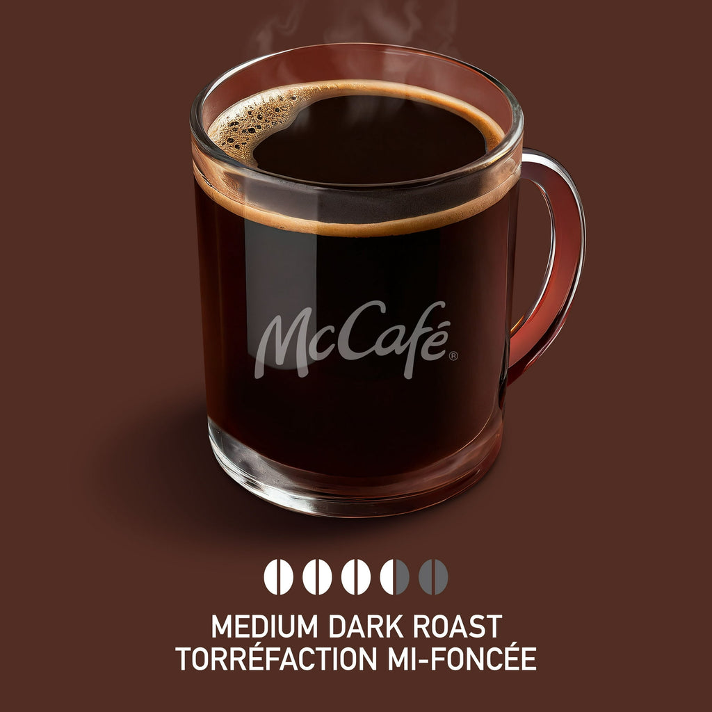 Glass mug of McCafé coffee on a brown background