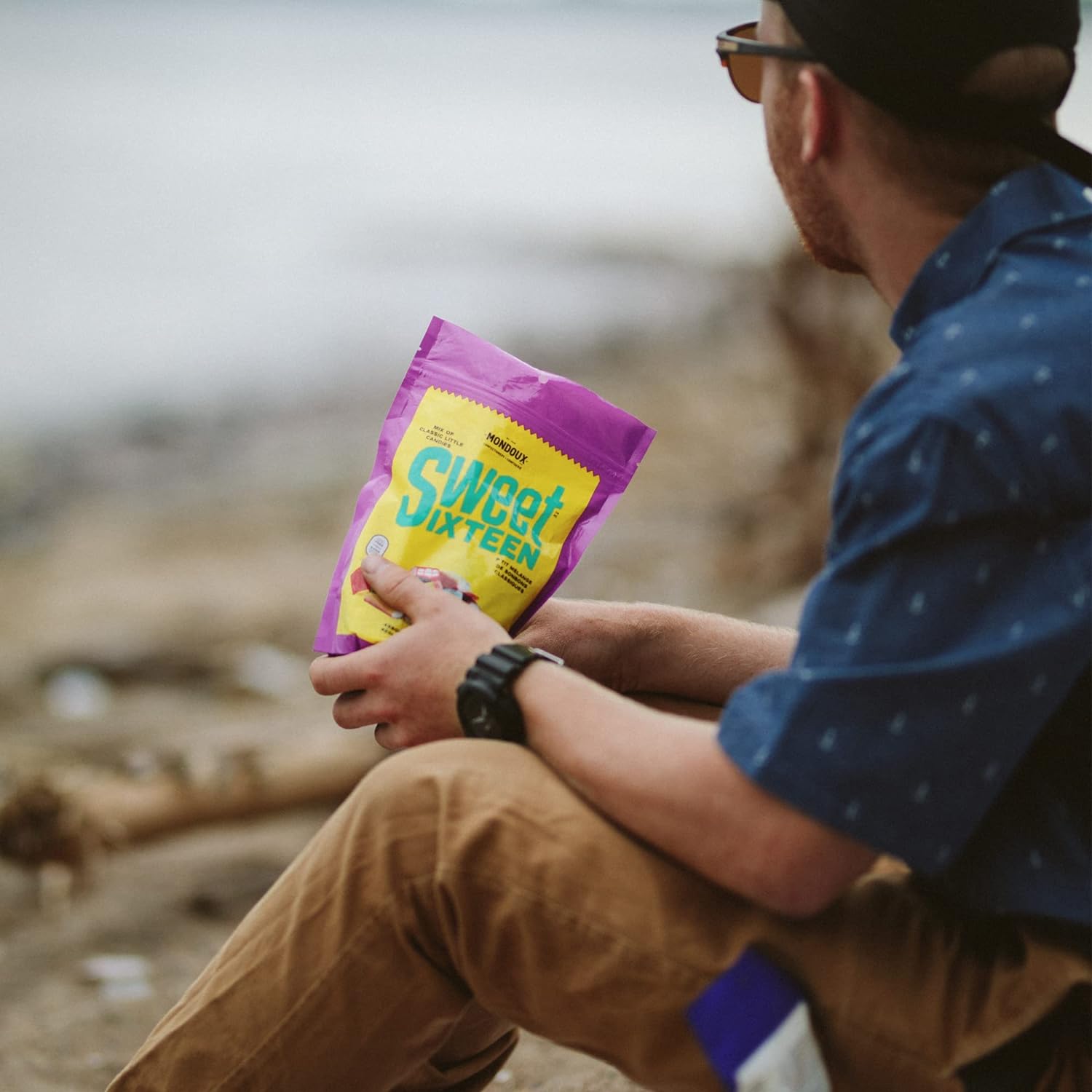 Mondoux Sweet Sixteen, Assorted Licorice Gummy Candy, 400g, picture of man holding a bag.