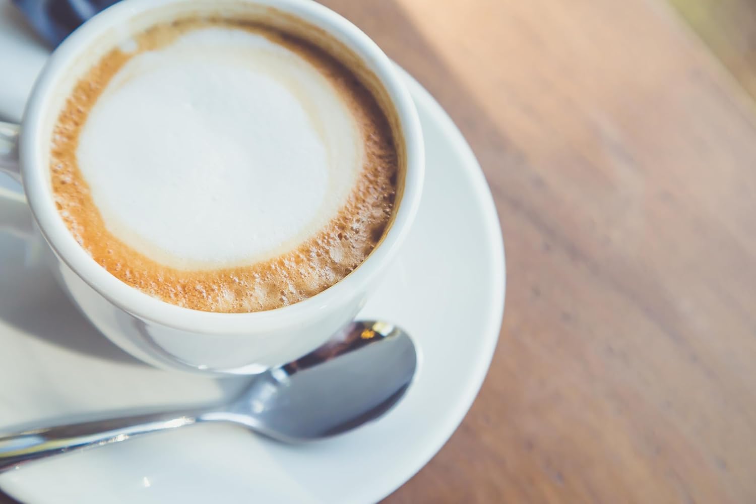 Mokate Gold Premium Caramel Flavored Latte, 10 x 14g Single Serve Sachets, 140g/4.9 oz., a cup of cappuccino.