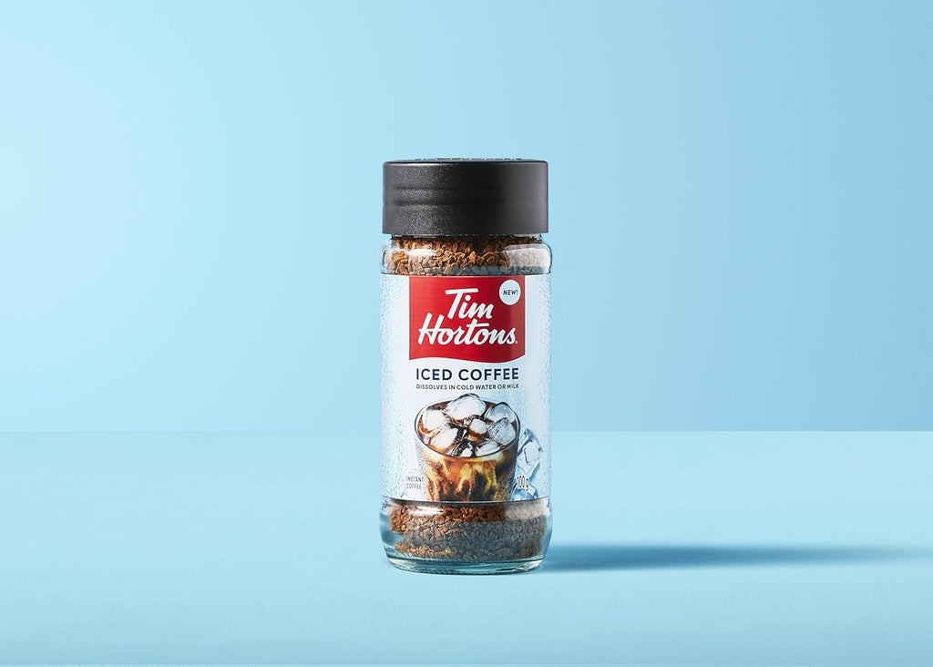 Tim Hortons 100% Colombian Instant ICED COFFEE (Medium) 100g/3.5 oz on a light blue background