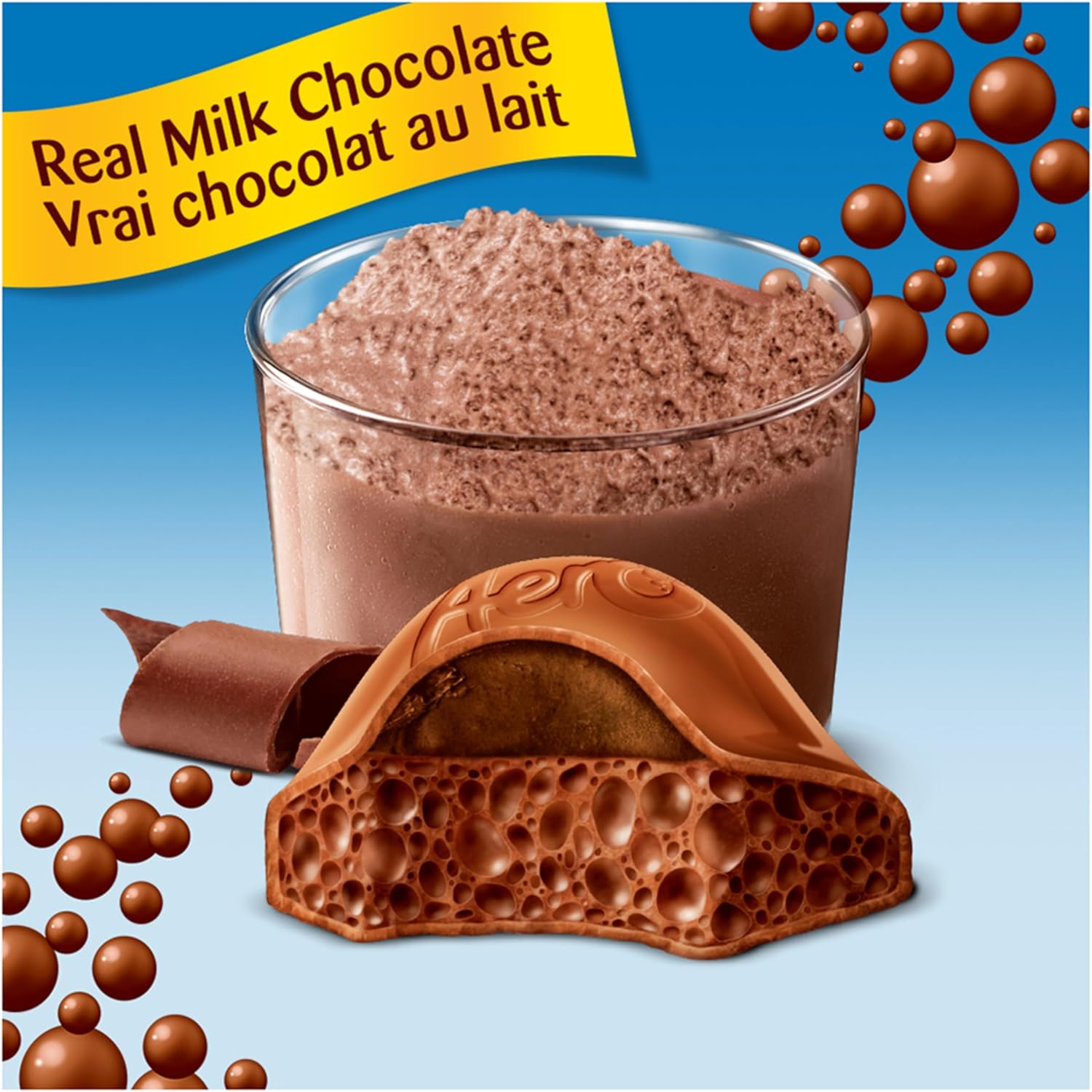 Glass of milk chocolate mousse and a piece of chocolate with text 'Real Milk Chocolate' on a blue background