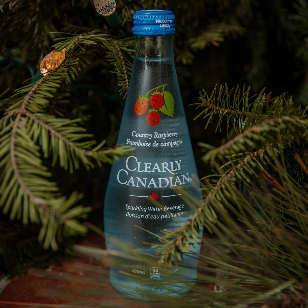 Clearly Canadian Sparkling Water Beverage, Country Raspberry, 325ml/11 Fl oz., Bottle, bottle on the table.