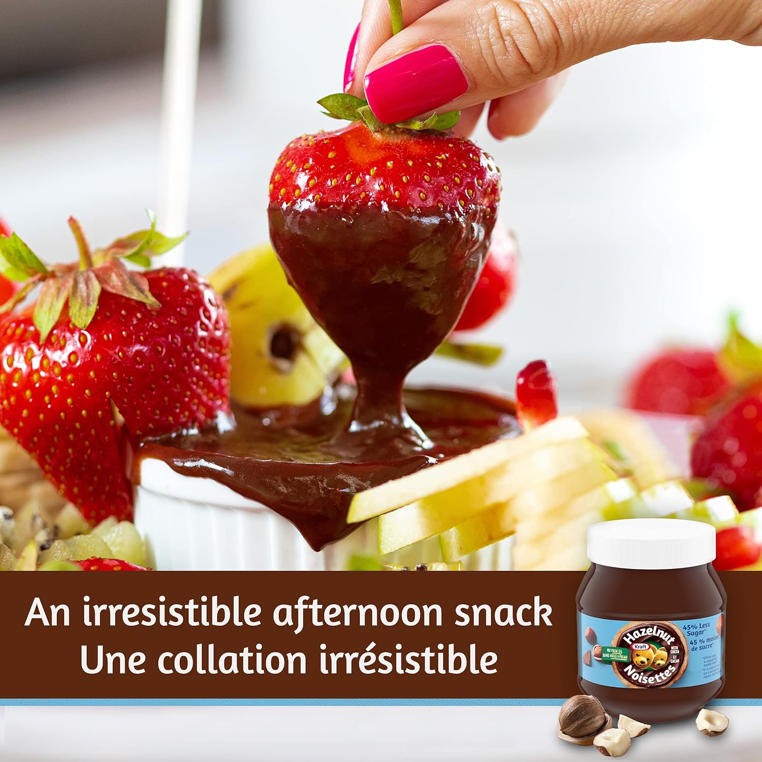 Strawberry being dipped into chocolate sauce with a jar of Nutella in the background.