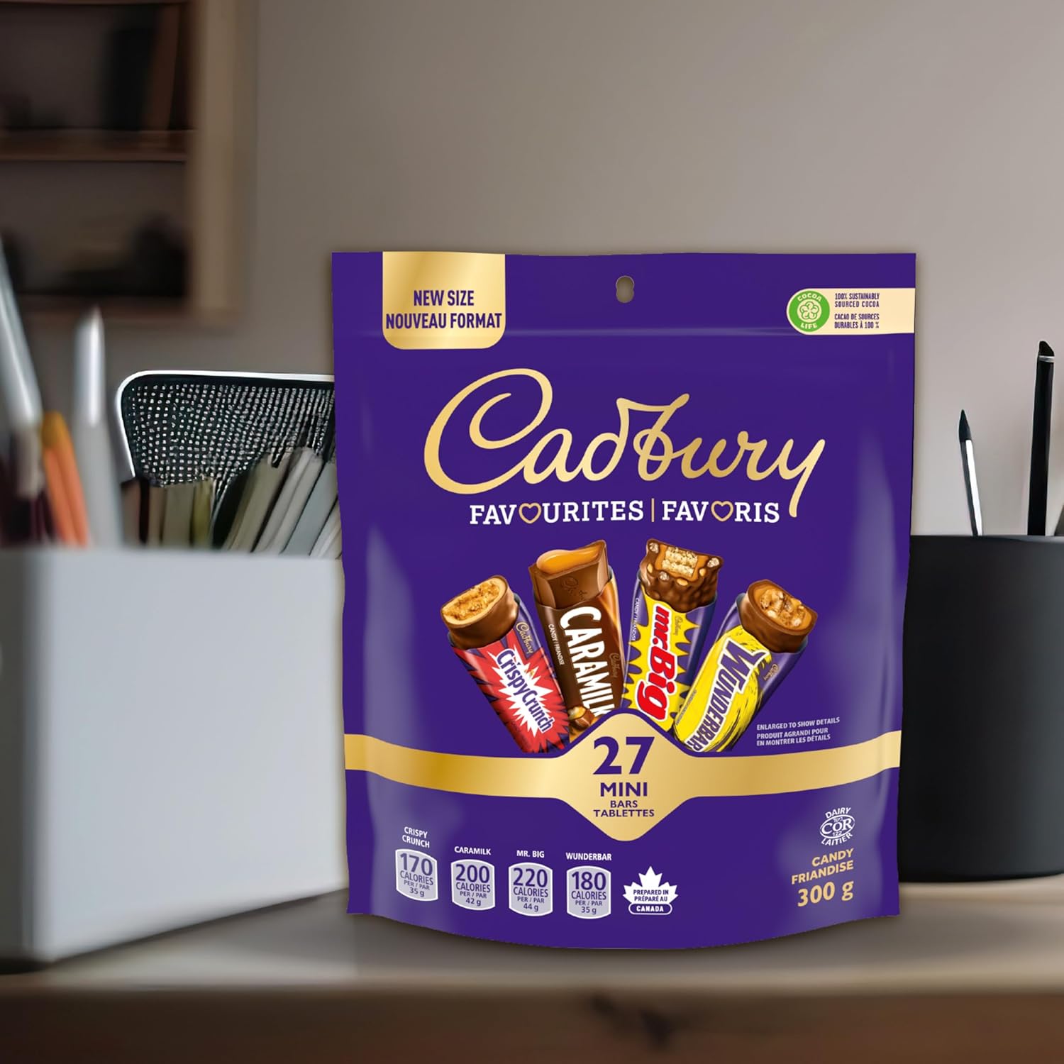 Cadbury Favourites chocolate package on a desk with office supplies in the background