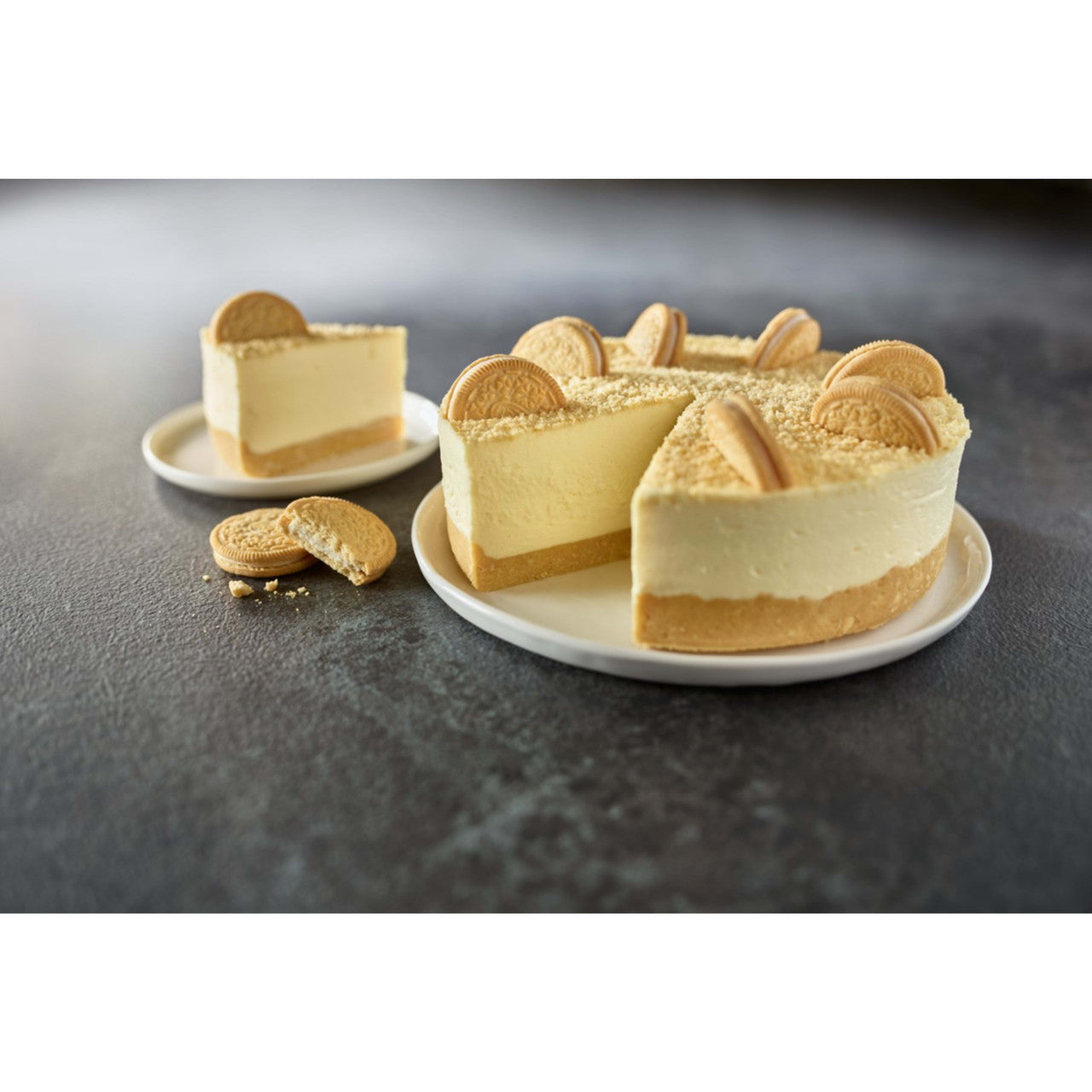 Cheesecake made with Oreo Golden cookies on a plate with a gray background