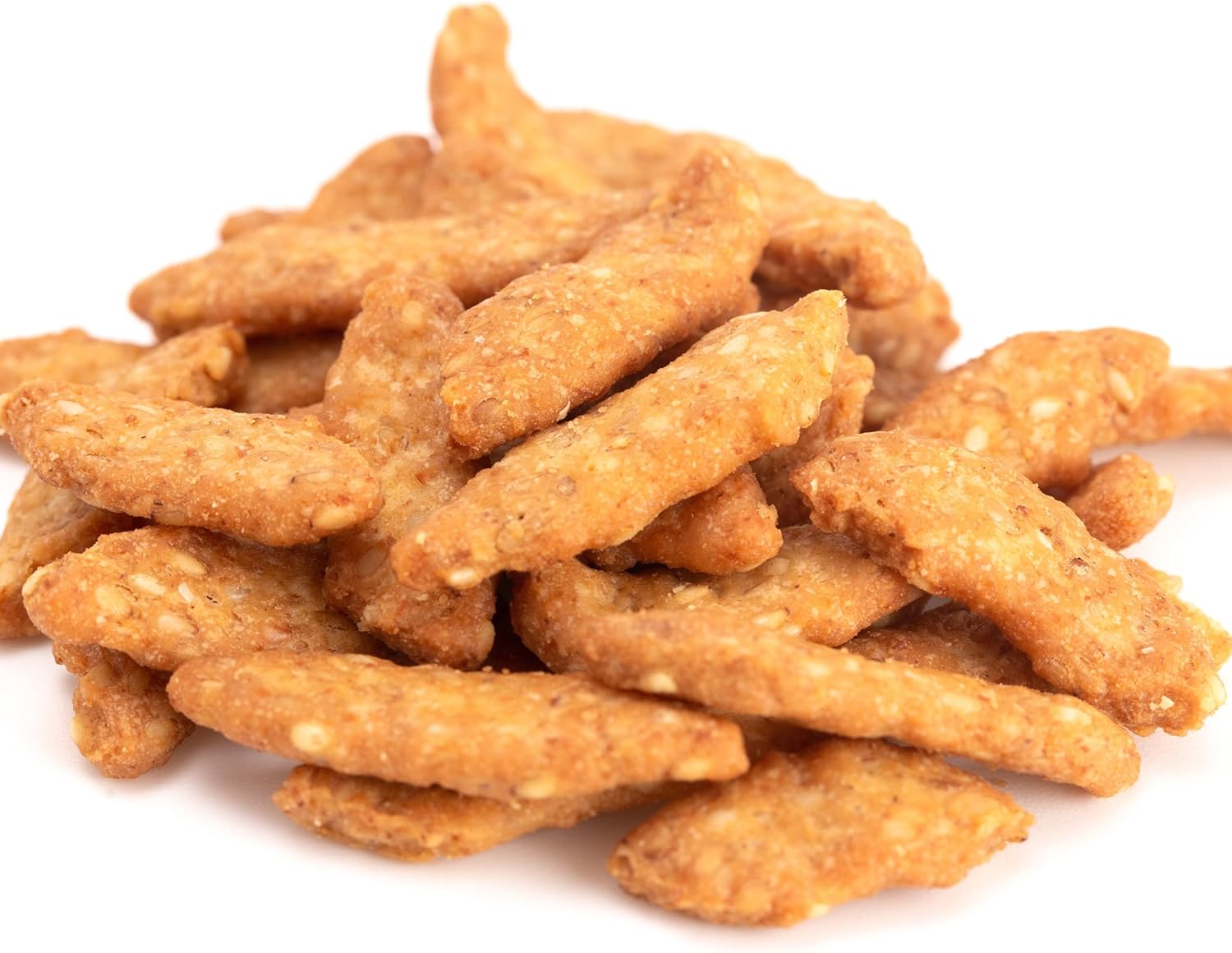 Pile of Yupik salted sesame sticks on a white background