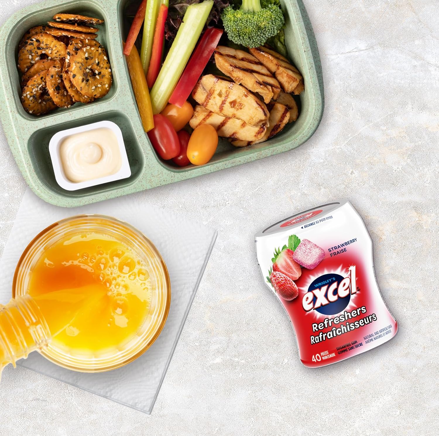 Excel Sugar-Free Gum, Refreshers Strawberry, 6 ct. Package, one bottle on lunch table.