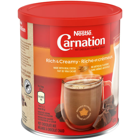 Nestle Carnation hot chocolate mix canister with red lid and label.