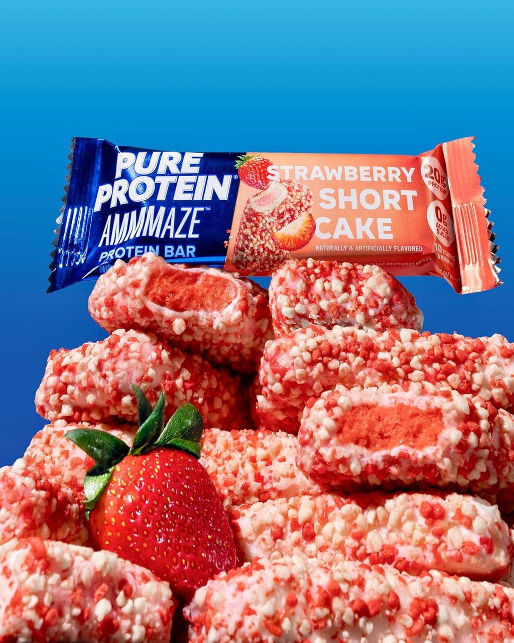 Stack of strawberry shortcake protein bars with a Pure Protein Ammamaze bar on a blue background