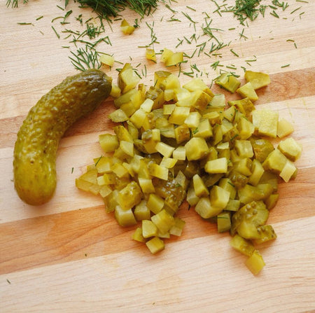 Bick's Premium Baby Dills Pickles Kosher Style 1L – product glamour shot showing whole baby dill pickles in jar