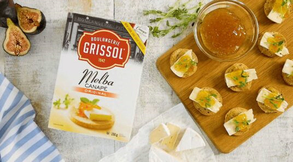 Boulangerie Grissol Melba Canape, Original, 150g, prepared canape slices snacks on a cutting board.