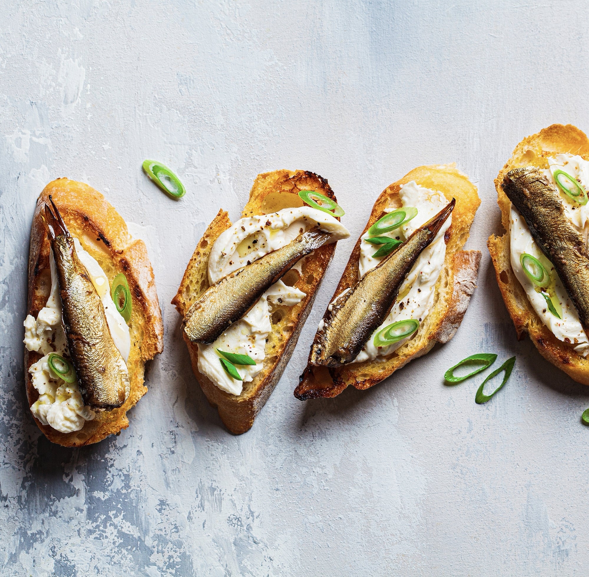 Brunswick Sardines in Spring Water served on toast with cream cheese — high protein meal idea