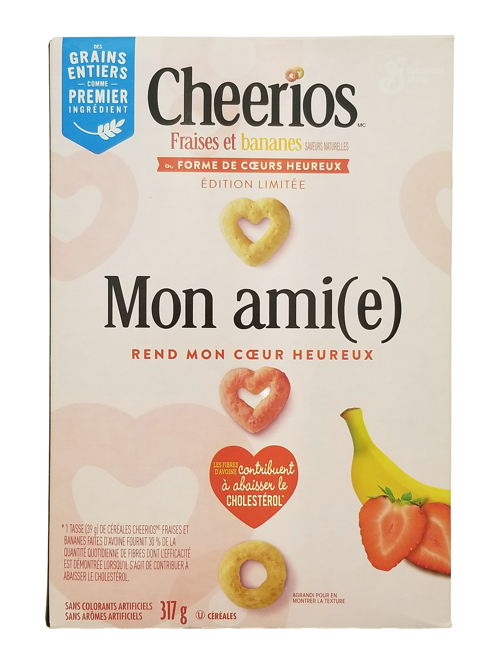 Cheerios cereal box with heart-shaped cereal and fruits on a light background