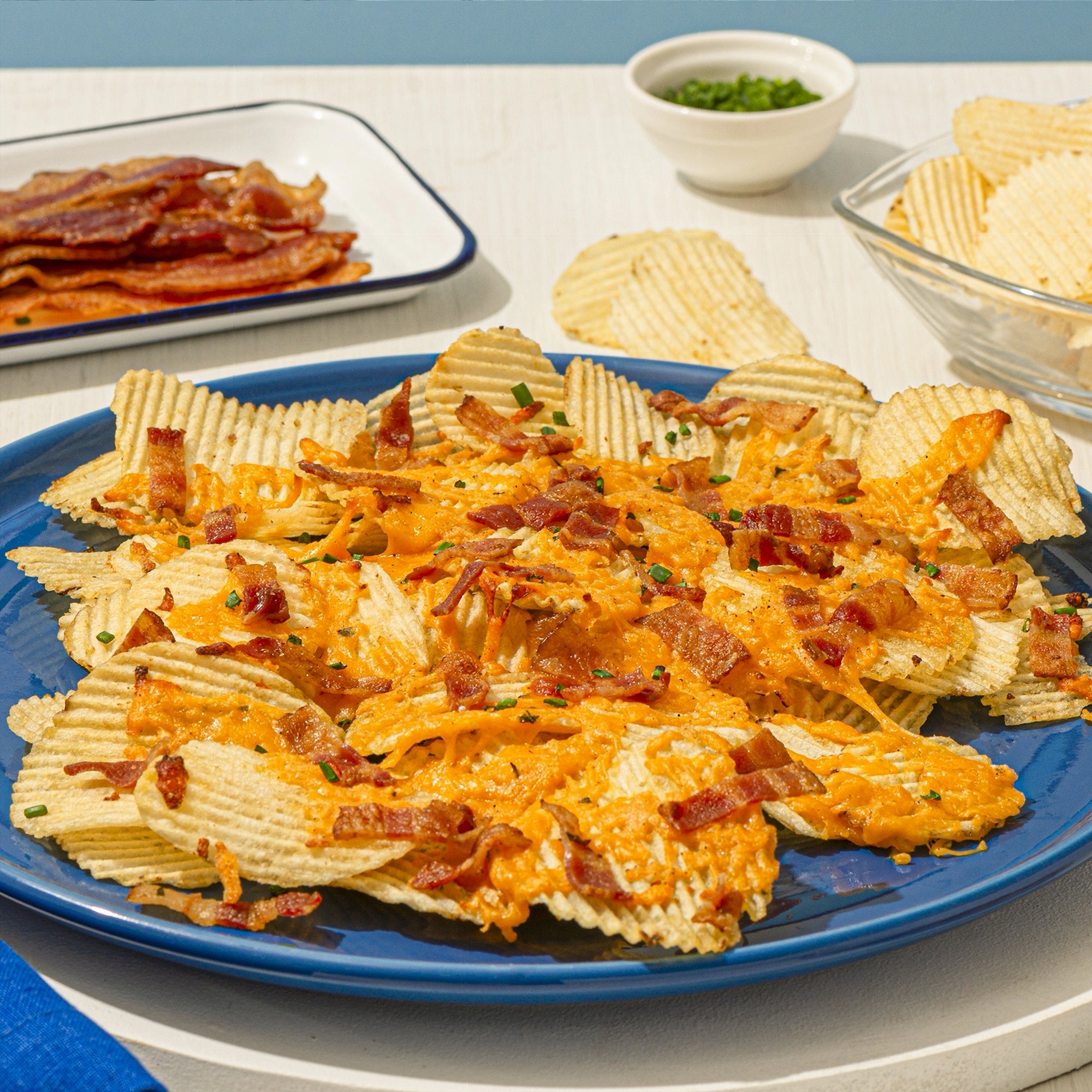 Compliments Extraaa Sour Cream & Bacon Ridged Potato Chips 200g side view