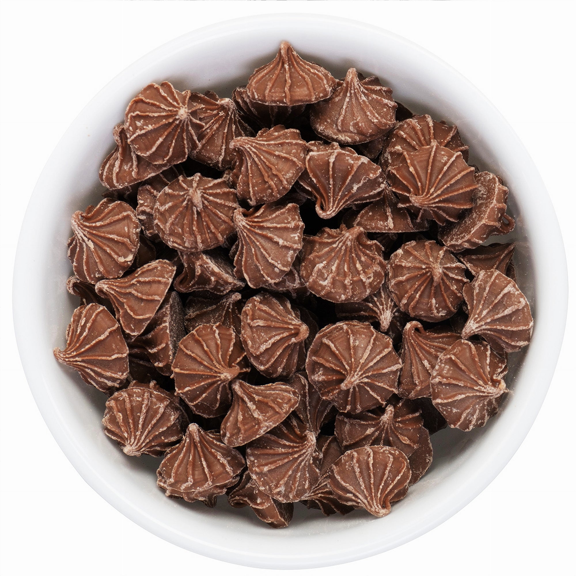 Close-up of chocolate drops in a white bowl on a white background