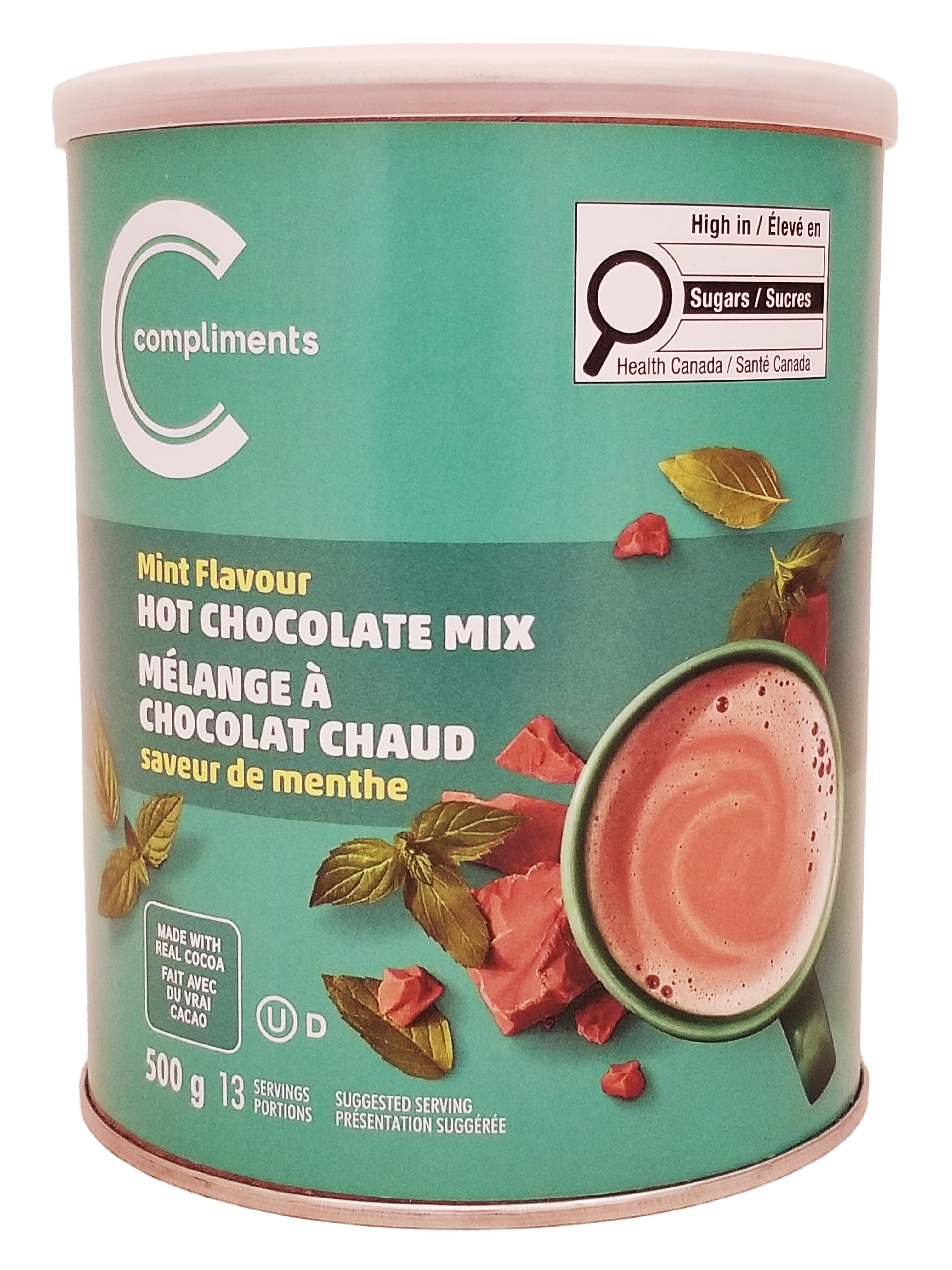 Green canister of mint-flavored hot chocolate mix 500g with 'Compliments' branding.