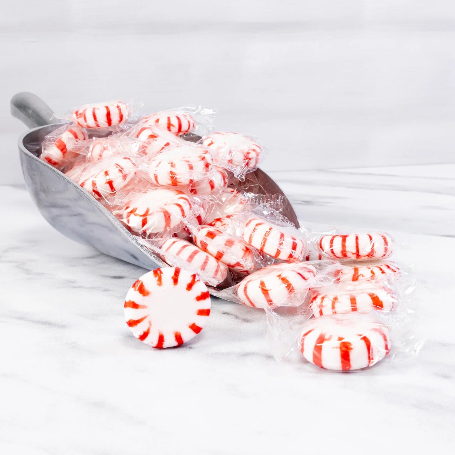 Bulk Cottage Country red striped peppermint mints spilling from a candy scoop