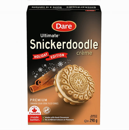 Box of Dare Ultimate Snickerdoodle crème cookies with a cinnamon stick on a white background