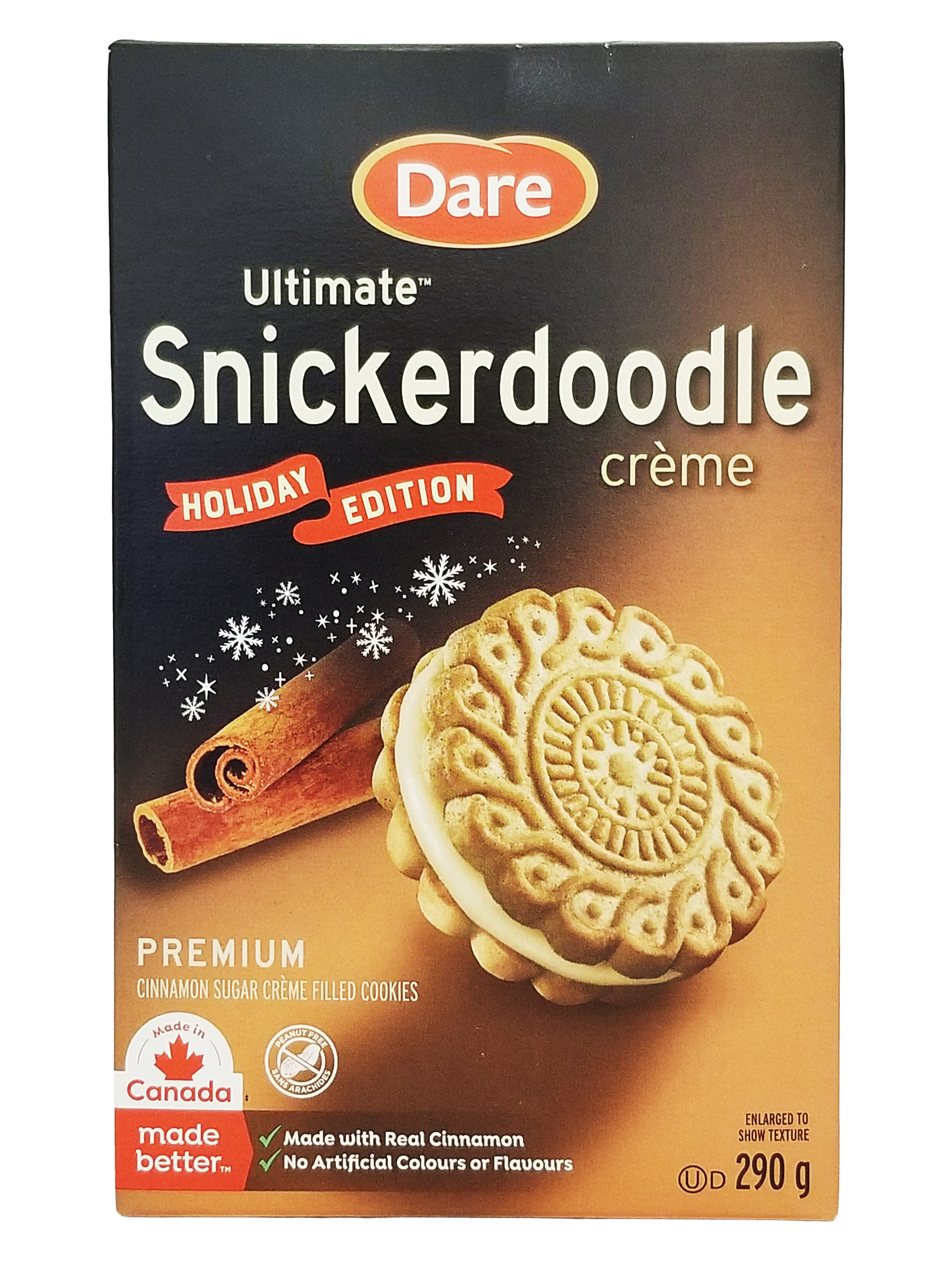 Box of Dare Ultimate Snickerdoodle crème cookies with a cinnamon stick and cookie on an orange background
