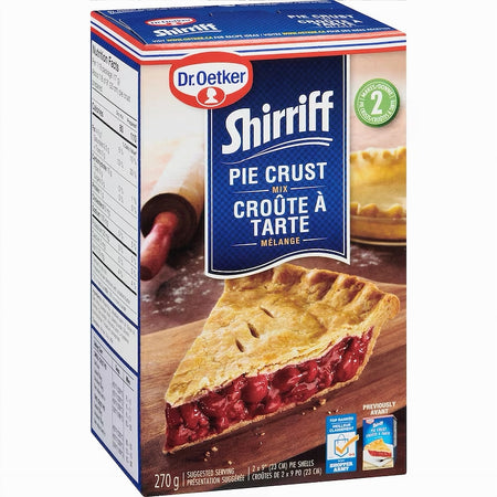 Box of Dr. Oetker Shirriff Pie Crust Mix with a pie on a wooden board.