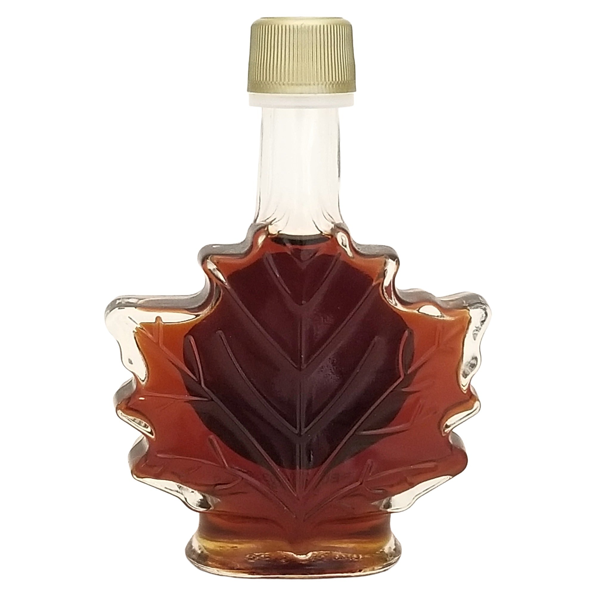 Back of Erabl'Or maple syrup glass bottle showing the embossed maple-leaf design and gold-colored cap.