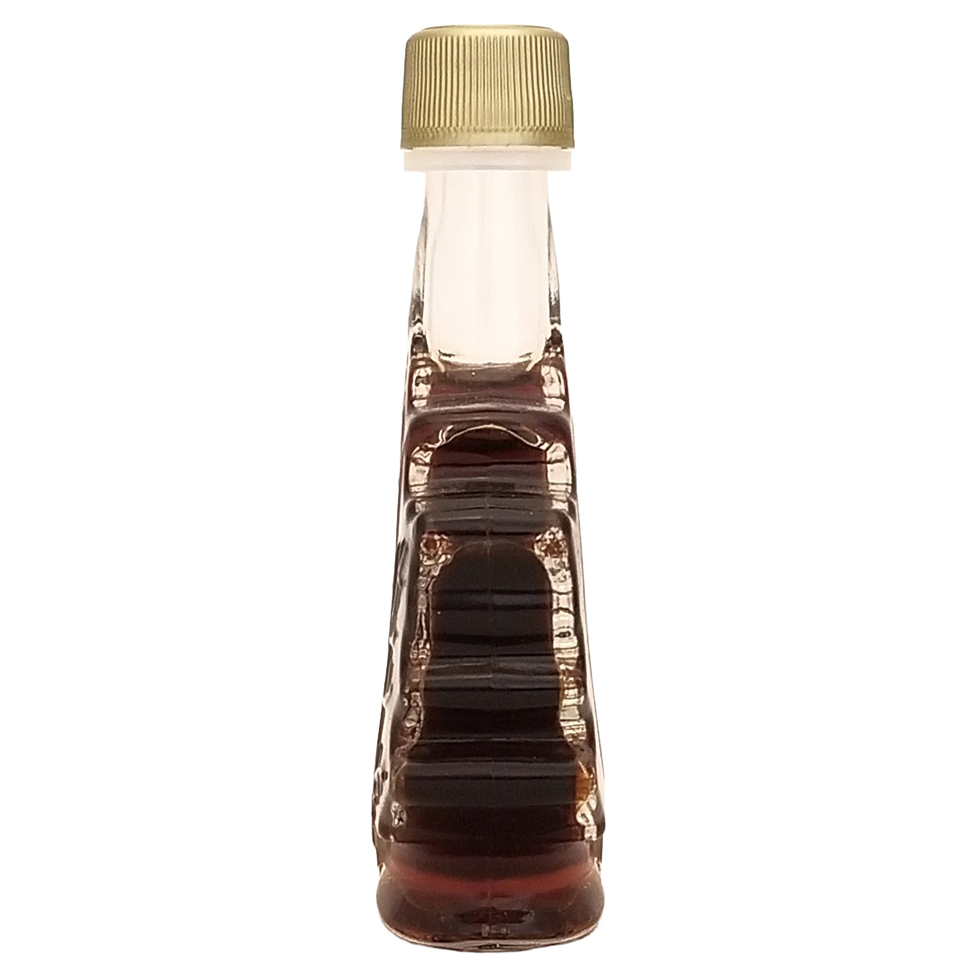 Side profile of Erabl'Or 50 mL maple syrup bottle showing its narrow glass shape and gold-colored cap.