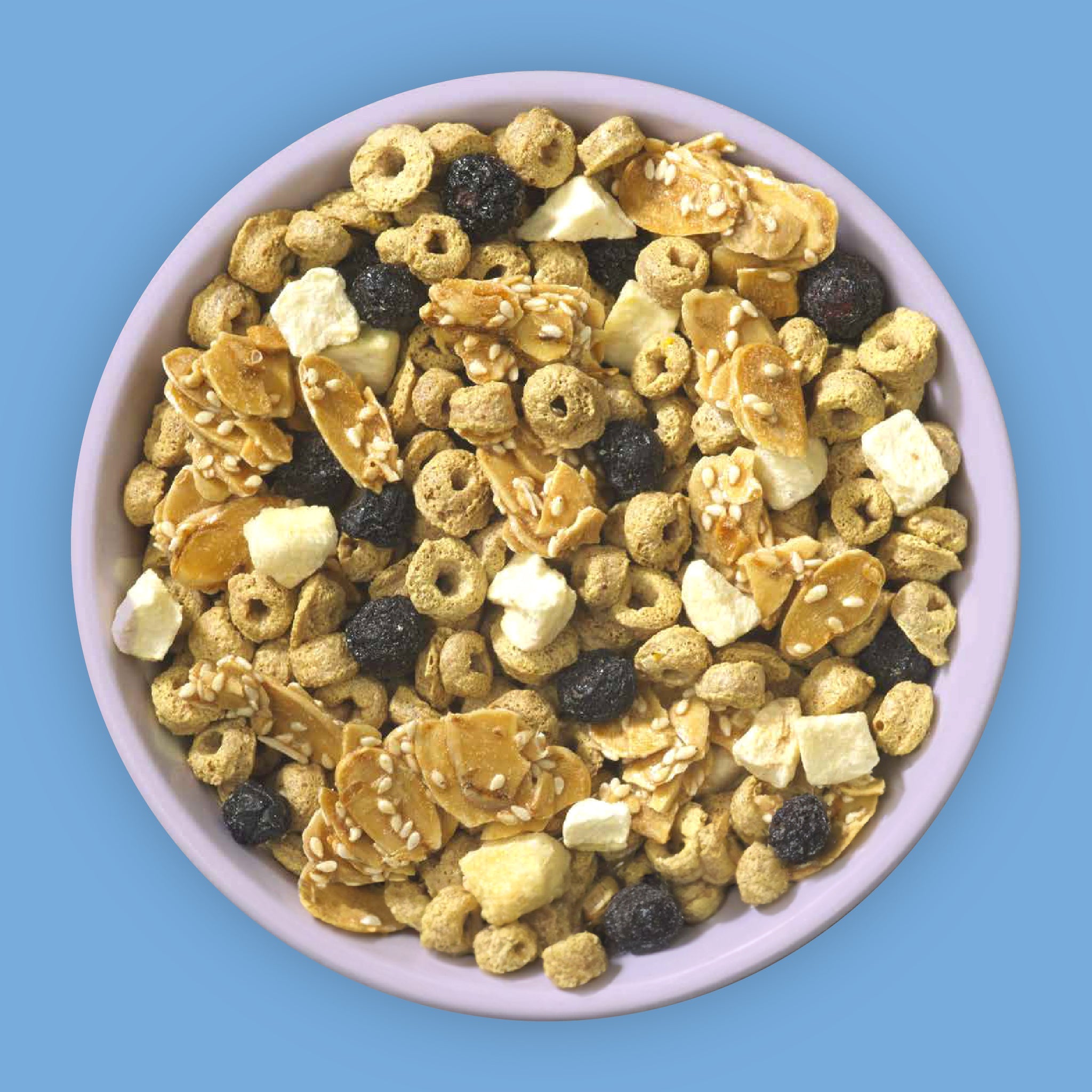 Farm Girl Peachy Blueberry Snaps Cereal, 280g/9.8 oz - Assorted cereal mix in a bowl on a blue background