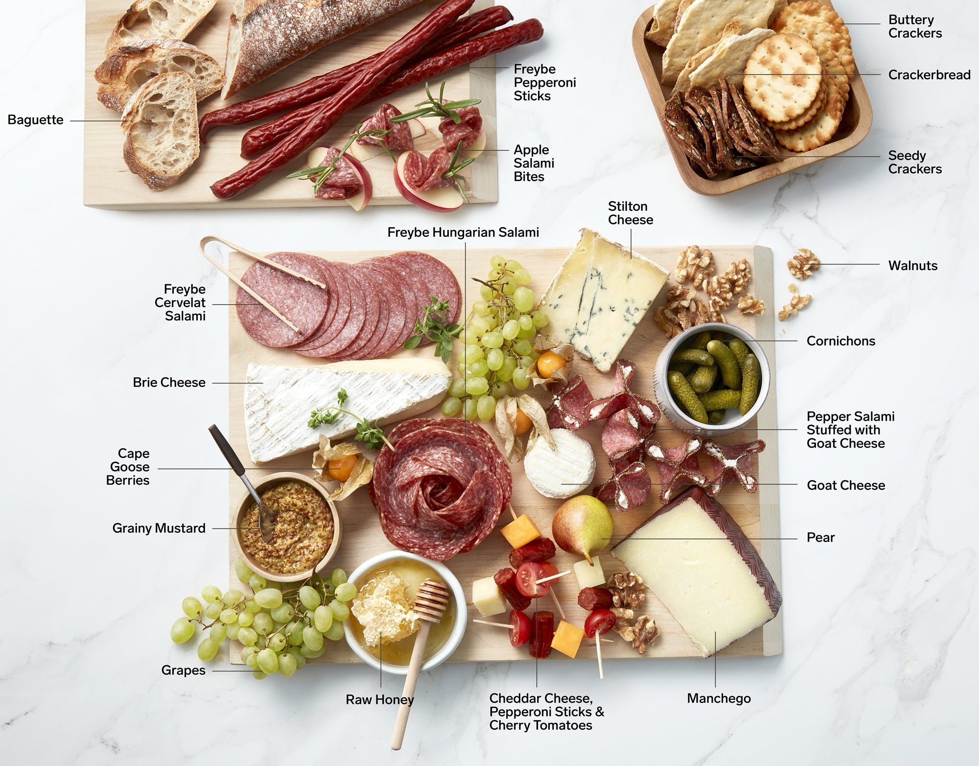 Charcuterie board loaded with cold cuts, crackers, bread, fruit and vegetables on a light marble surface