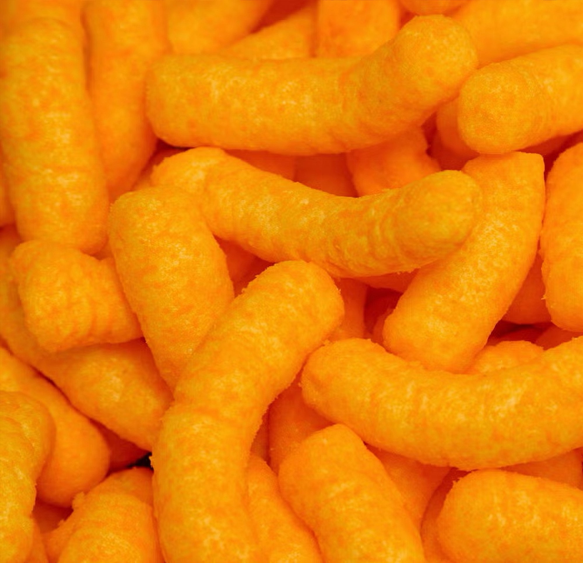 Close-up of orange cheese puffs