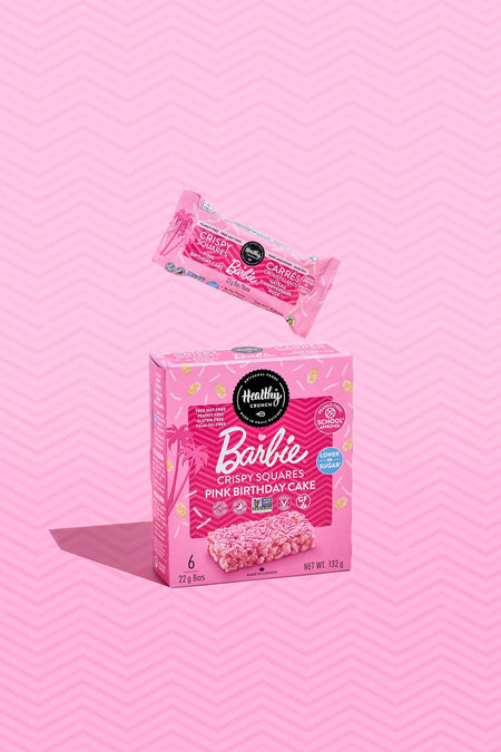 Pink box of Barbie Crispy Squares with a pink background