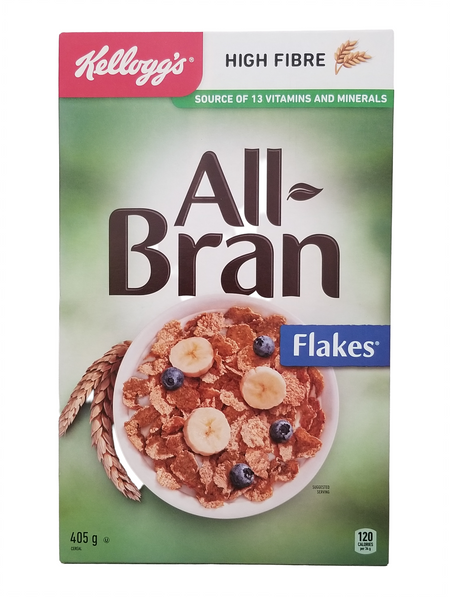 Kellogg's All Bran Flakes cereal box with a bowl of cereal and fruit on a green background