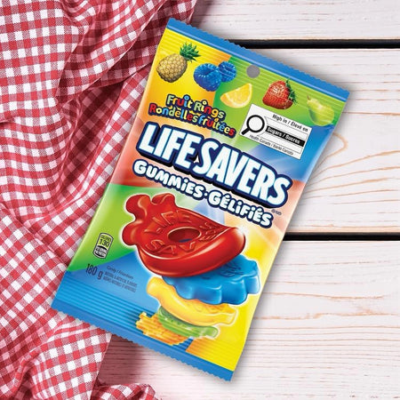 Lifesavers Gummies package 180g on a wooden surface with a red checkered cloth