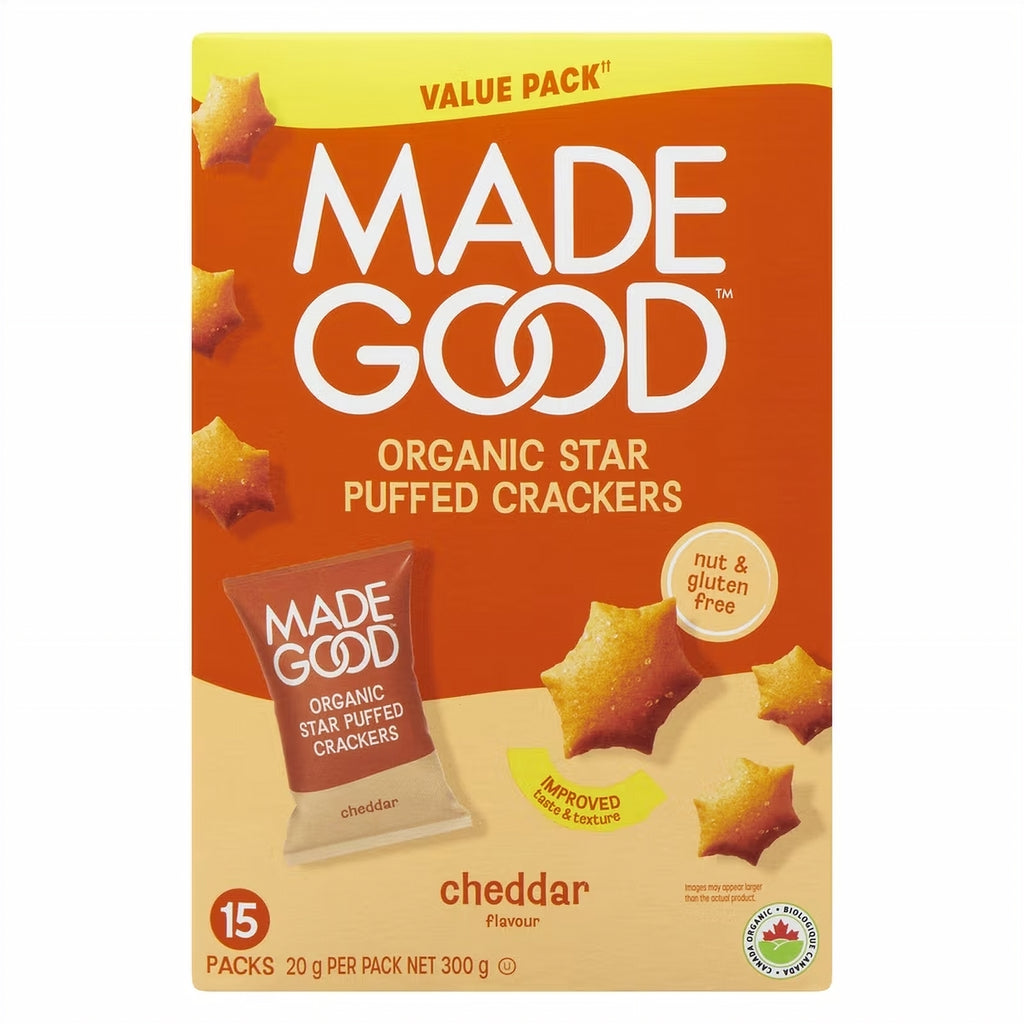 Box of Made Good organic star puffed crackers with cheddar flavor on an orange background