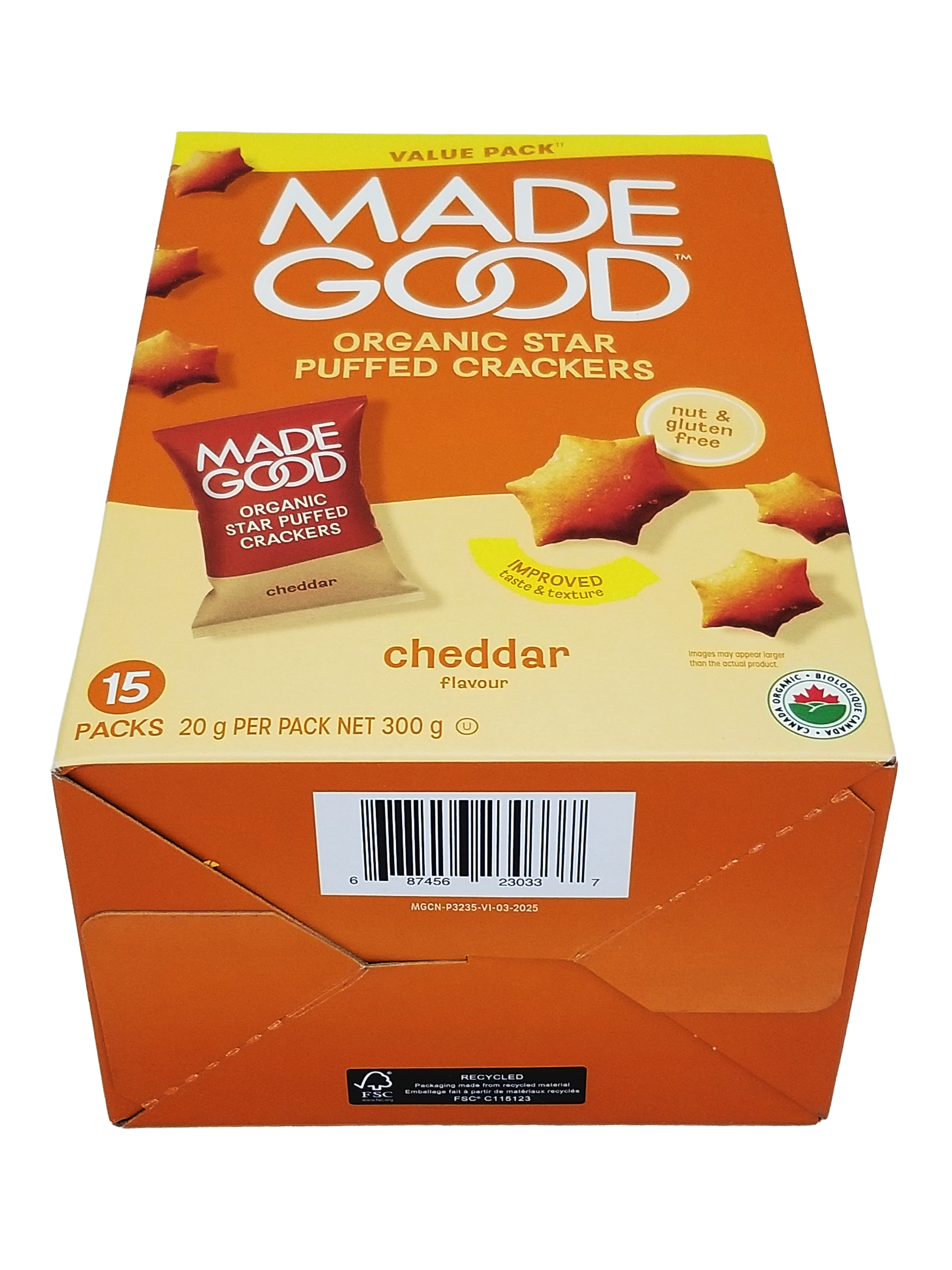 Box of Made Good organic star puffed crackers with cheddar flavor on an orange background
