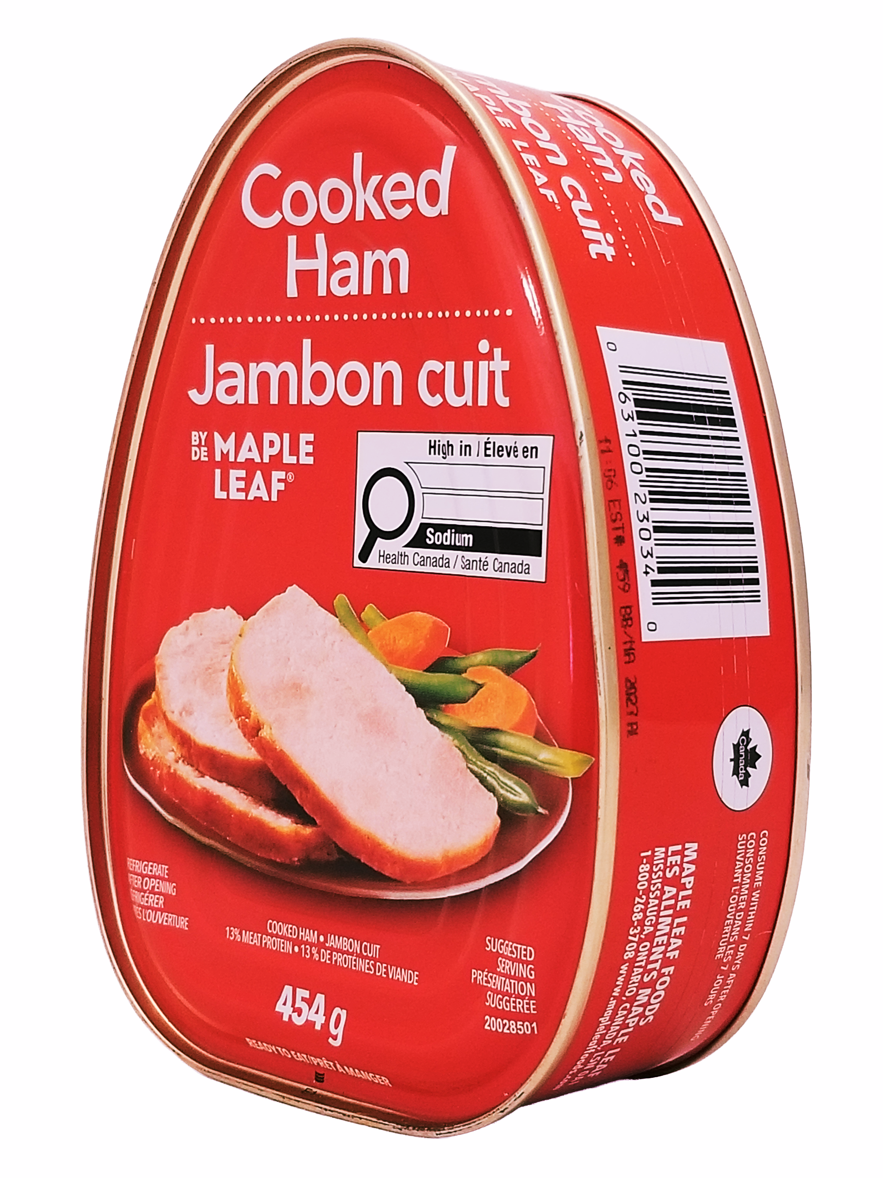Red can of Maple Leaf cooked ham with a label showing slices of ham and vegetables on a white background.